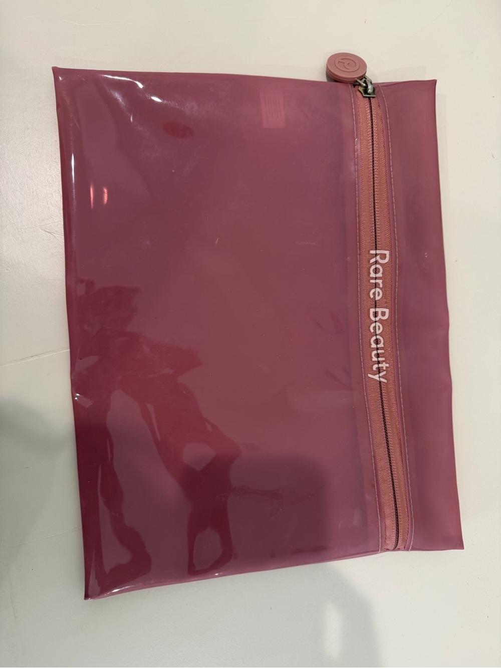 Rare Beauty mauve pink glossy cosmetic pouch